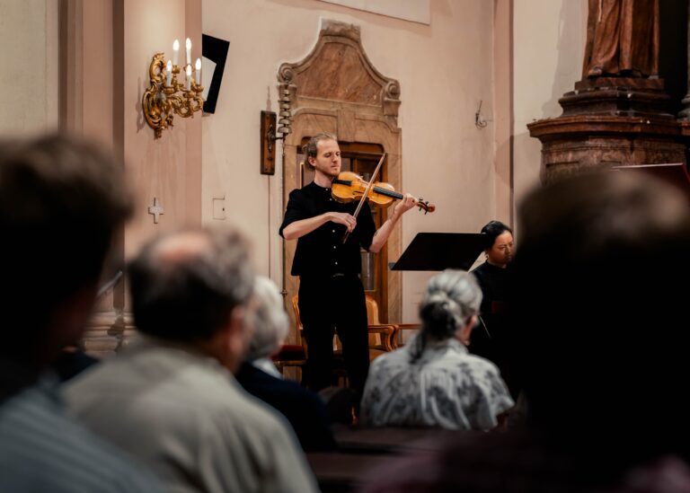 violinist playing at baroque concert