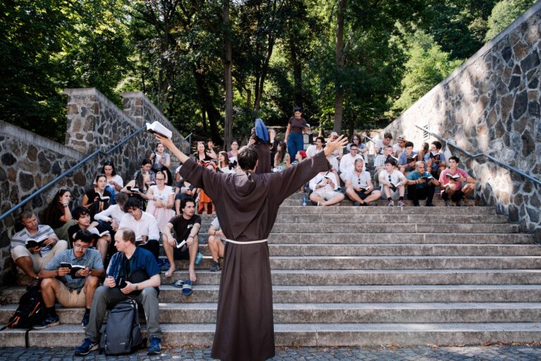 Franciscan friar standing in front of chorus