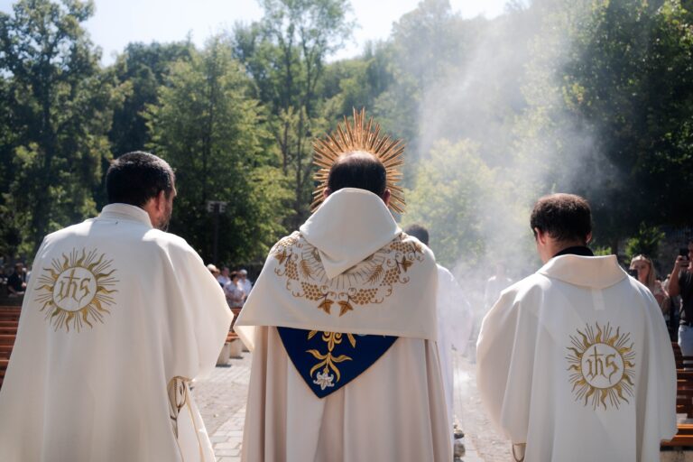 catholic priest in a eucharistic procession