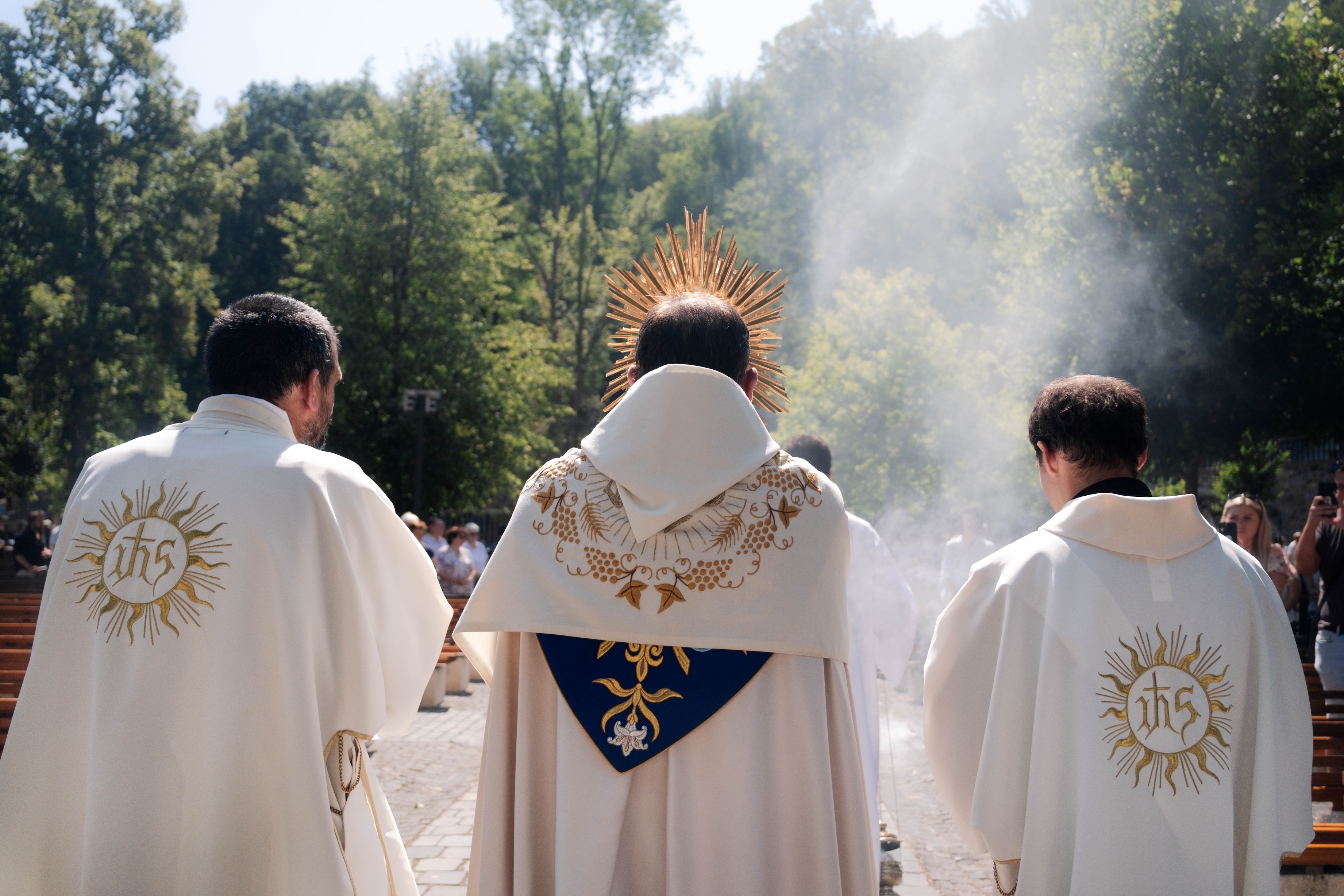 catholic priest in a eucharistic procession