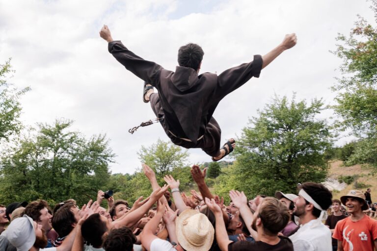 Franciscan Friar being tossed in the air